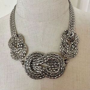 Silver tone knotted multi chain statement necklace